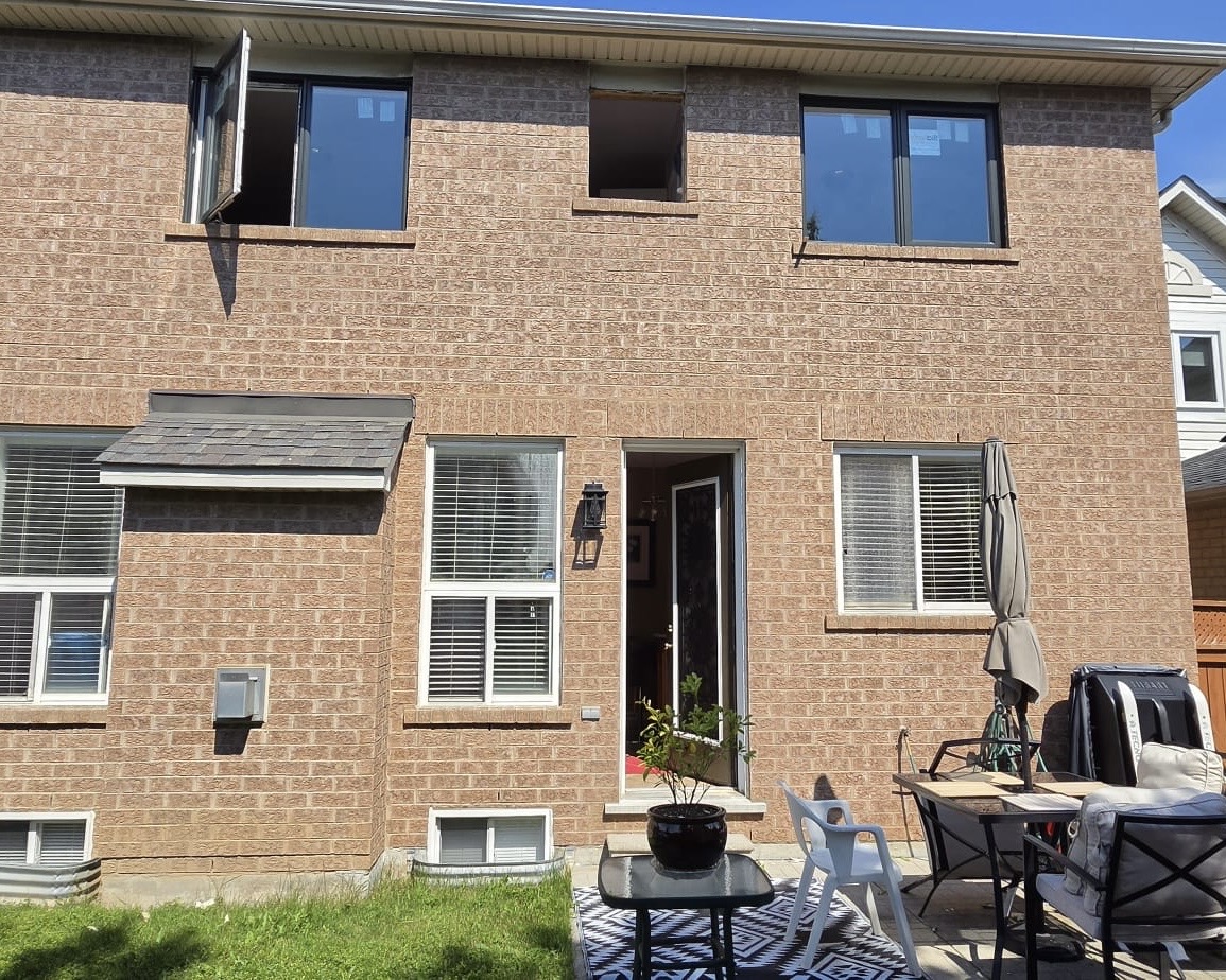 Rear elevation during the window replacement with awning units open
