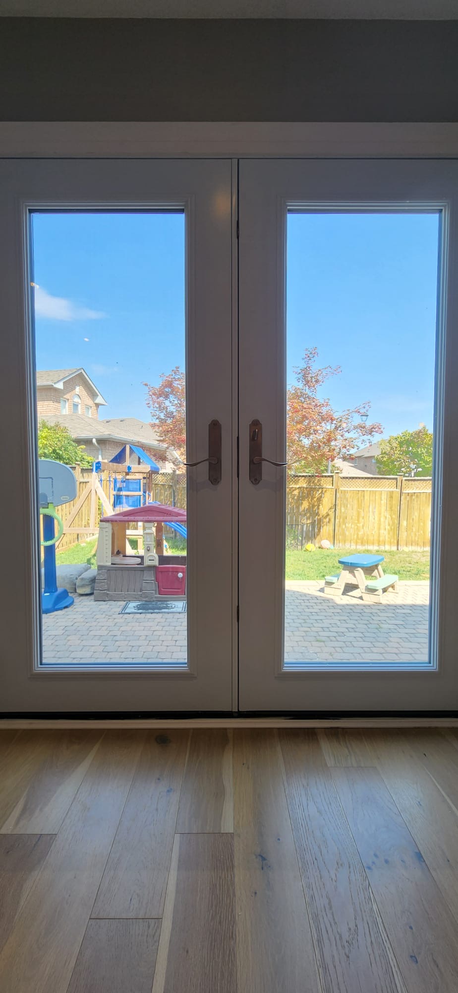 White French garden doors opening to the backyard