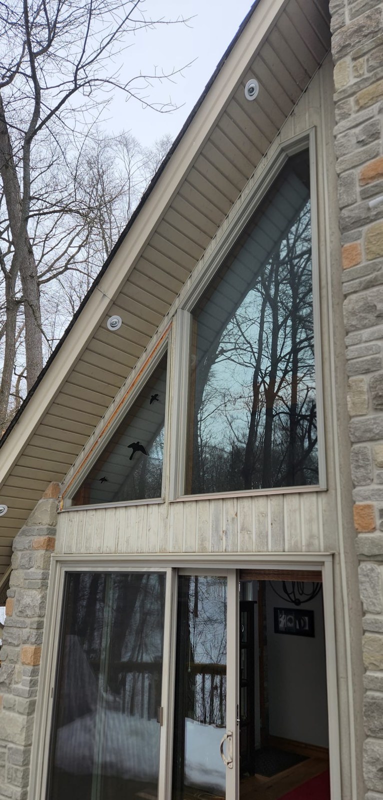 Custom-shaped A-frame windows following the roofline